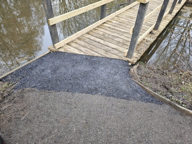 The tarmac ramp at the West end of the walkway